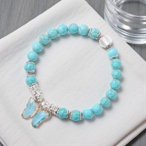 Védelem – Türkiz karkötő pillangó medállal